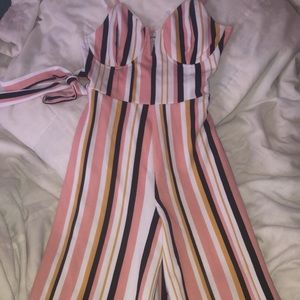 Pink, black, and white striped one piece jumpsuit. Practically new.